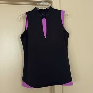 Sleeveless woman’s Golf shirt. Navy/pink highlights.  Versatile top- tennis too!